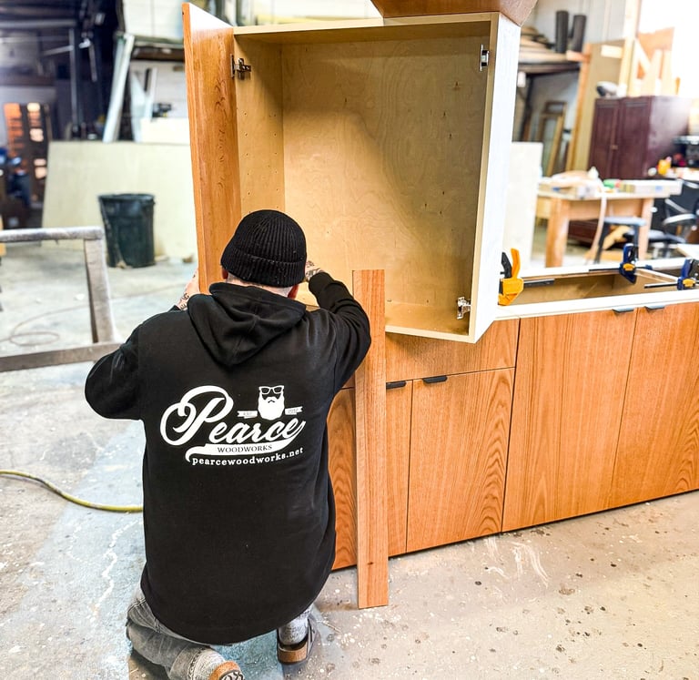 Master woodworker and artisan craftsman handmaking custom cabinetry.