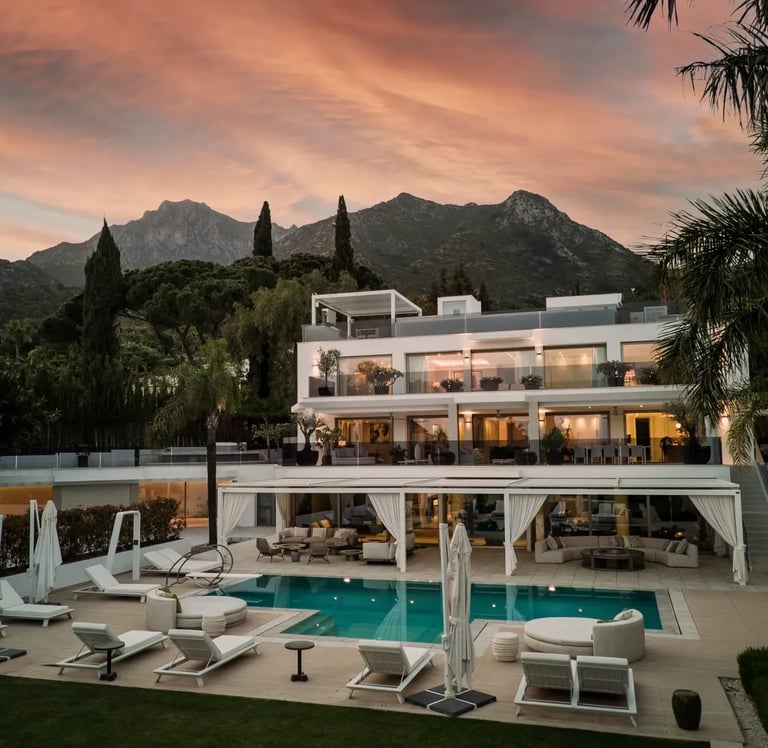 Sunset view of Villa Serenity exterior with pool and gardens