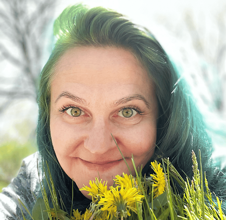 a woman with green hair and yellow flowers