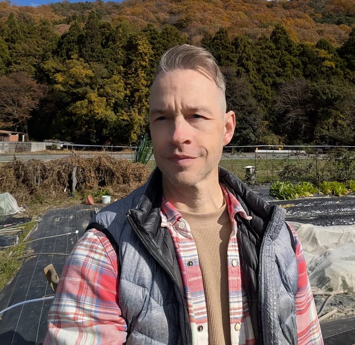 man standing in garden
