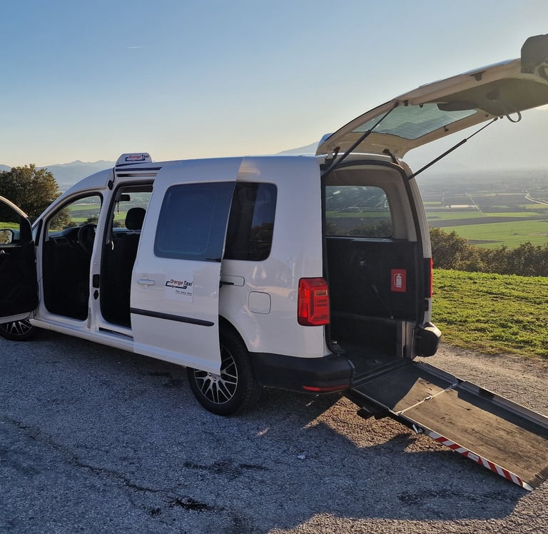 White wheelchair accessible taxi with ramp in Kavala - Orange Taxi disability transfers