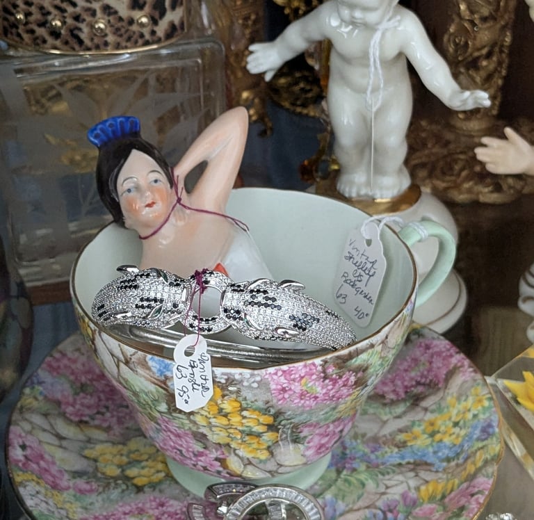 ceramic woman in a teacup
