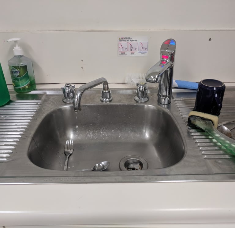 old leaking kitchen sink taps