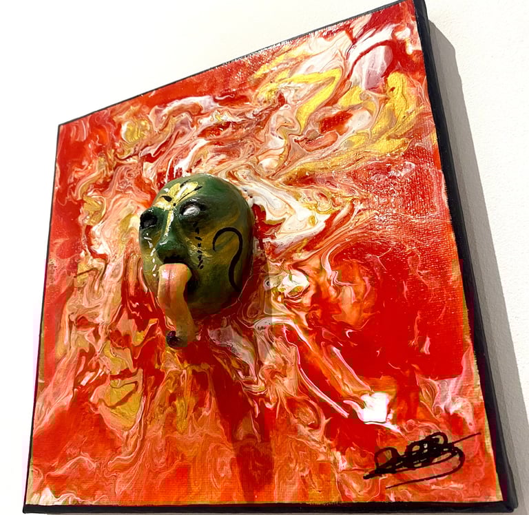 une sculpture avec une longue langue qui émerge d'un tableau rouge vu de côtés