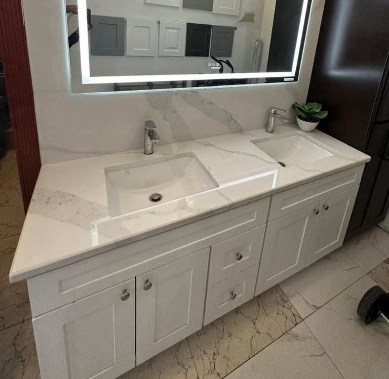 a bathroom with a large mirror and a chandelier
