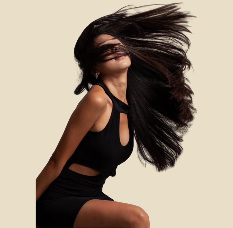 a woman with long hair and a black dress