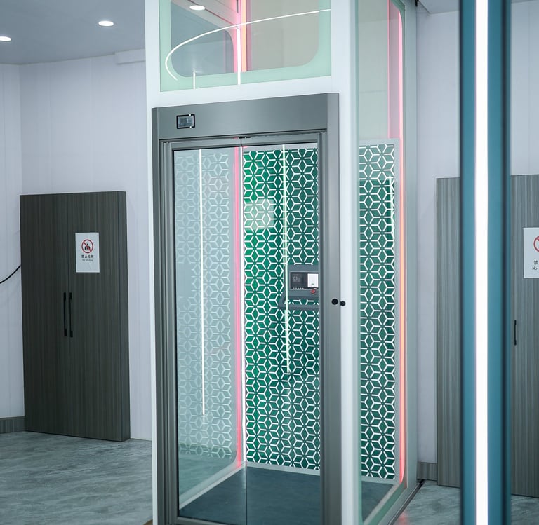 Modern luxury home elevator with glass walls and decorative interior LED lighting.