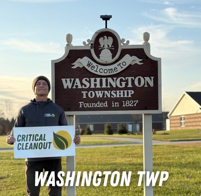 “Critical Cleanout team at the Washington Township MI welcome sign showing our local junk removal and clean-out services.