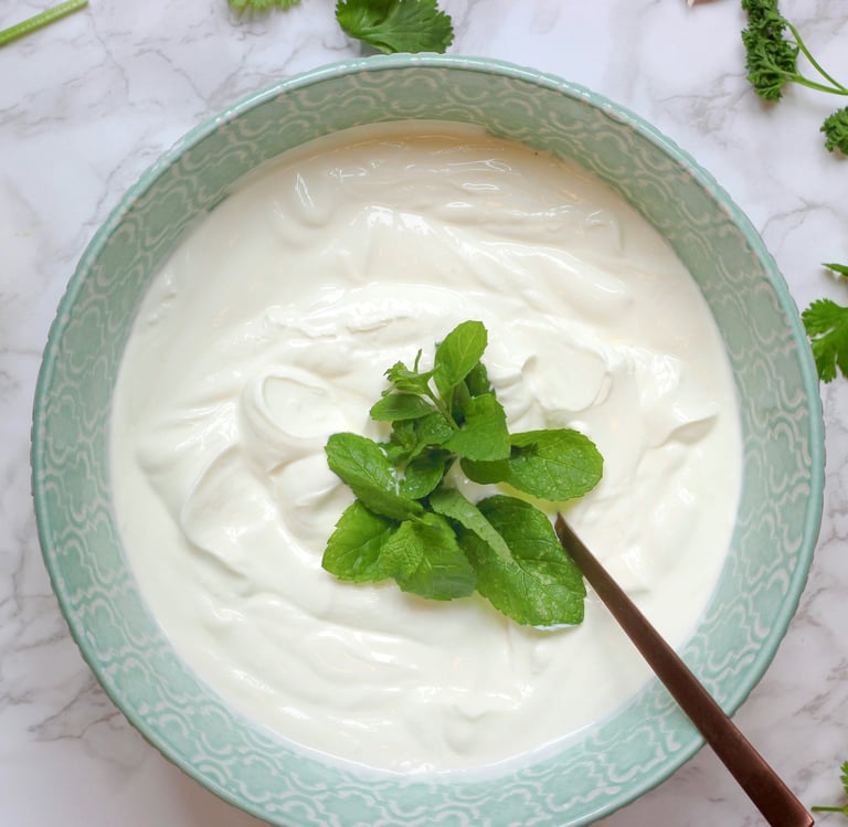 bowl of natural yoghurt with mint