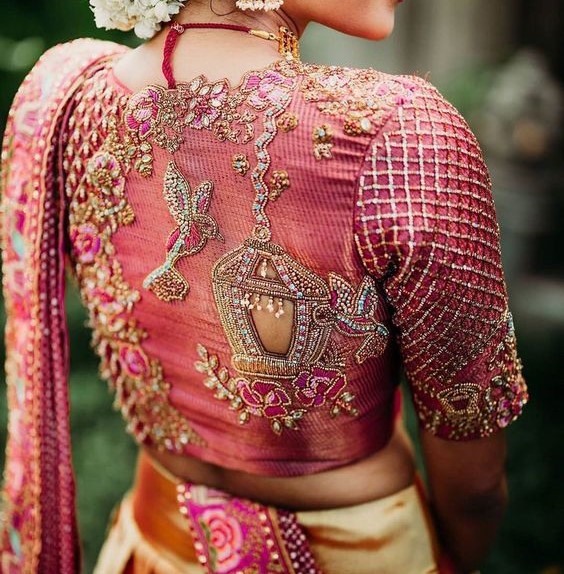 Women wearing ping blouse with aari work design