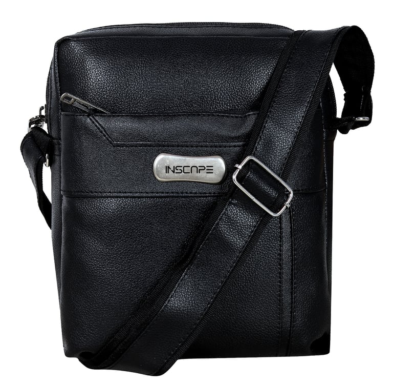 a black leather sling bag with a metal buckle