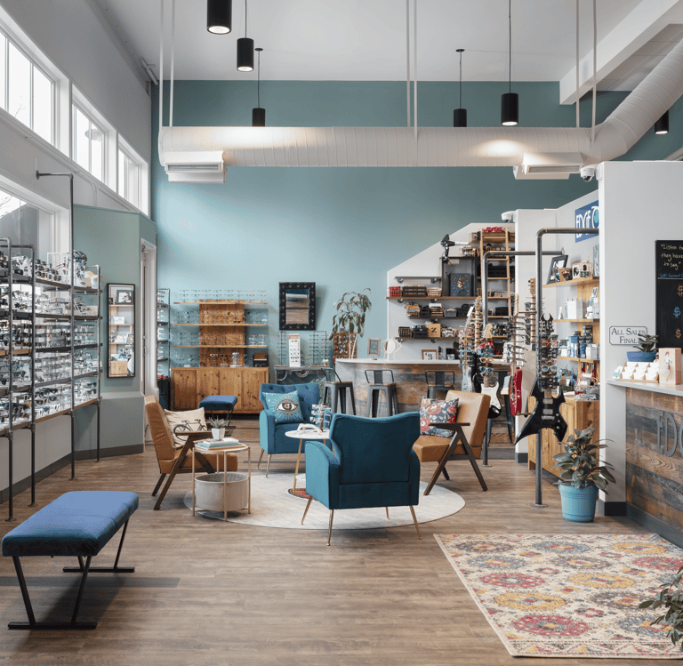 Interior showroom at Edge Optics Fort Collins location, with stylish seating and eyewear to shop