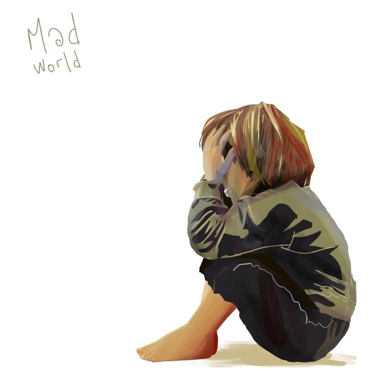 Petit gaçon assis par terre qui se prend la tête dans les mains. Le mot mad world lui fait face.