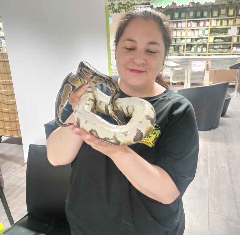 a woman holding a snake snake snake snake snake snake snake snake snake snake snake snake