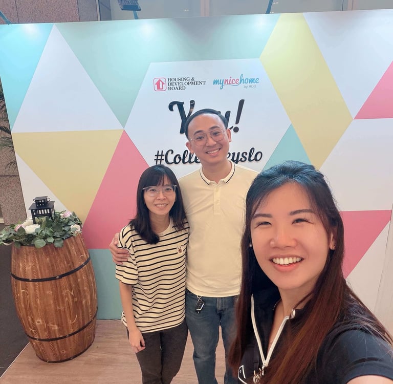 Happy homeowners with Tracy and Colelyn after a successful property journey in Singapore