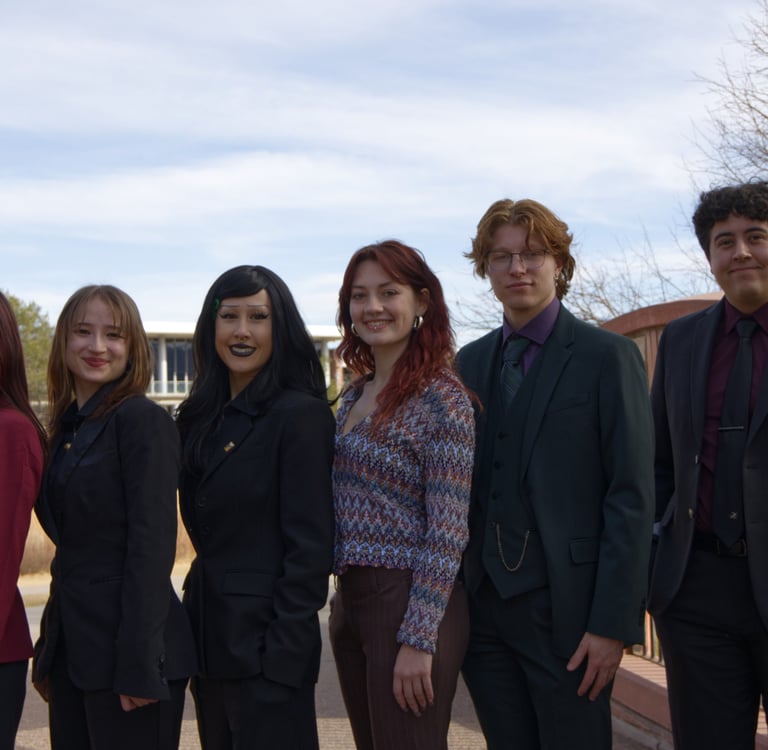 Image of Quesada-Stoner Gregg team standing next to each other.