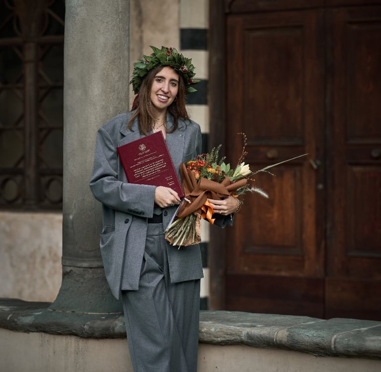 a woman in a suit and a flower crown