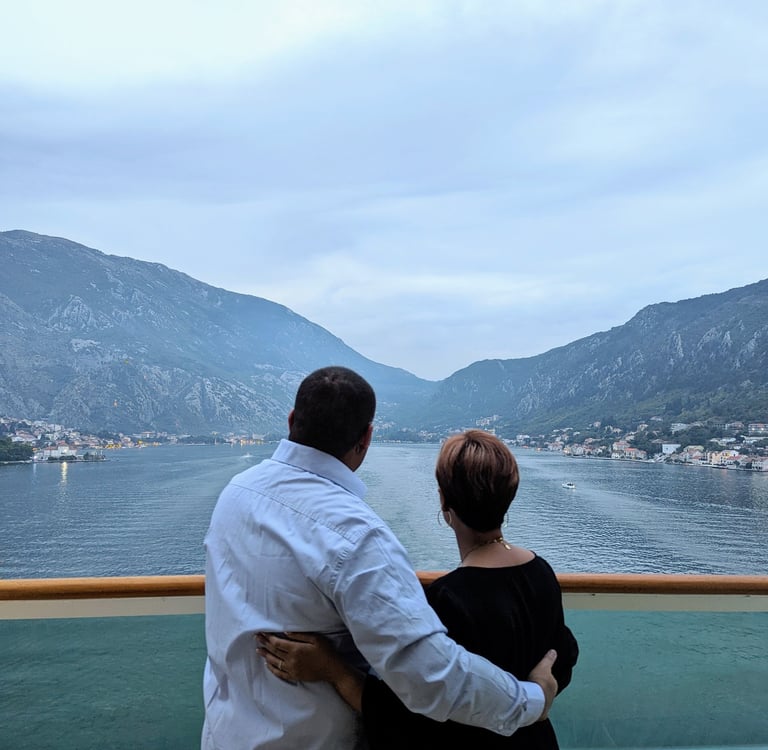 My wife and I on the back of a boat in the bay of Kotar, Montenegro
