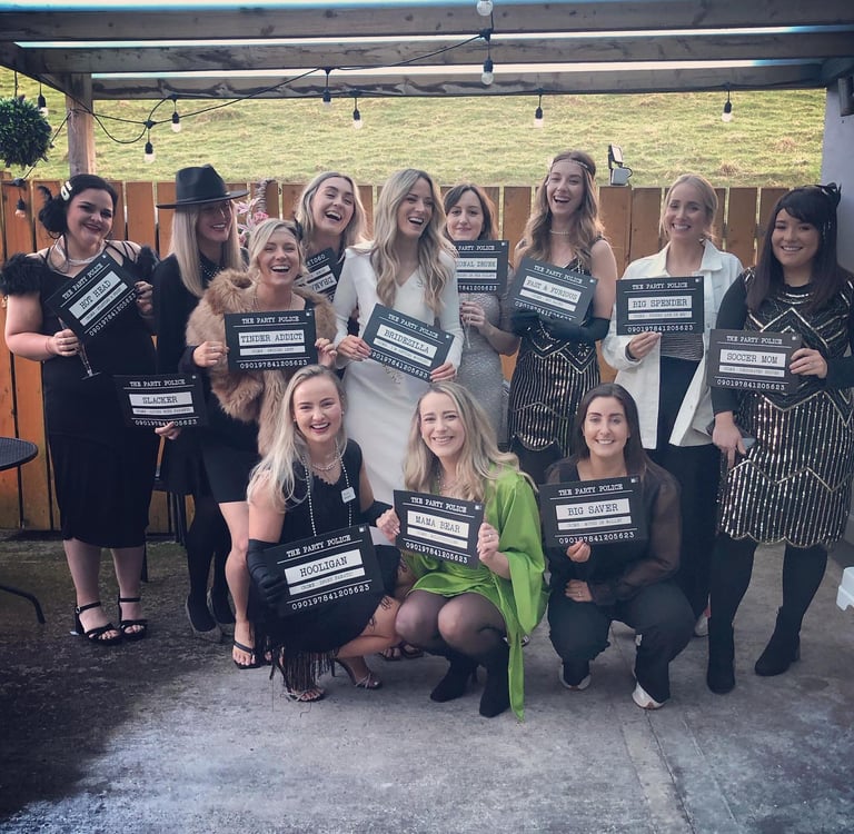 a group of girls at a1920s murder mystery party.