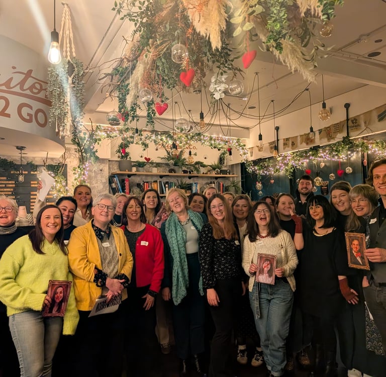 a group of people smile for a photograph after having fun at a themed Traitors party.