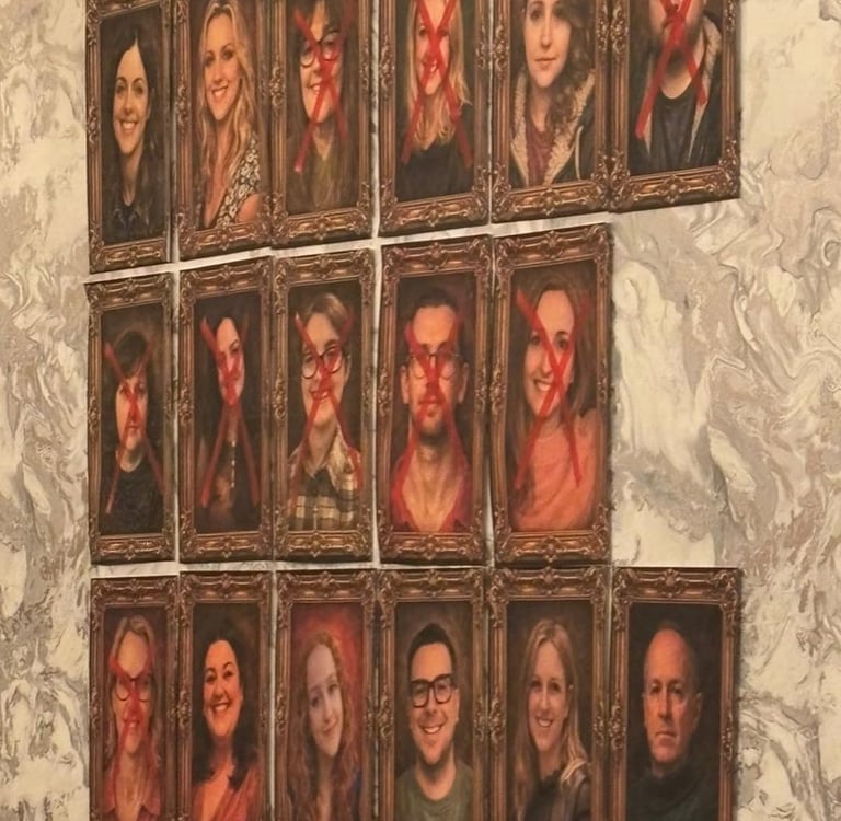 pictures of people in portrait frames. some have their faces crossed out with a red X. Traitors night.