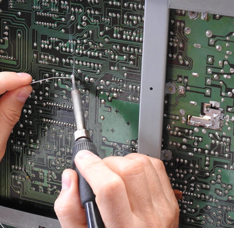 Soldering a board. Repairing audio electronics. 