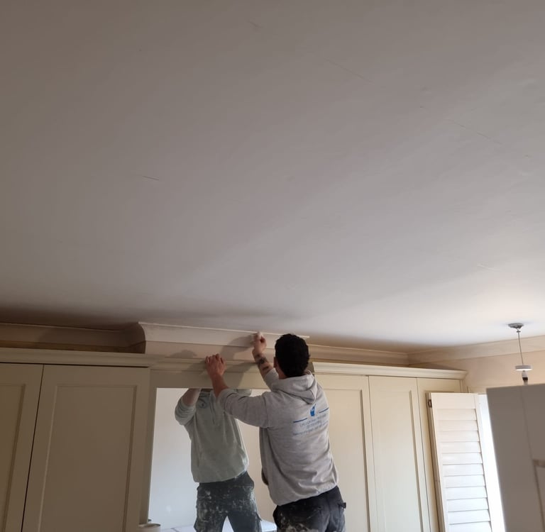 Our staff decorating an interior room in a residential home.