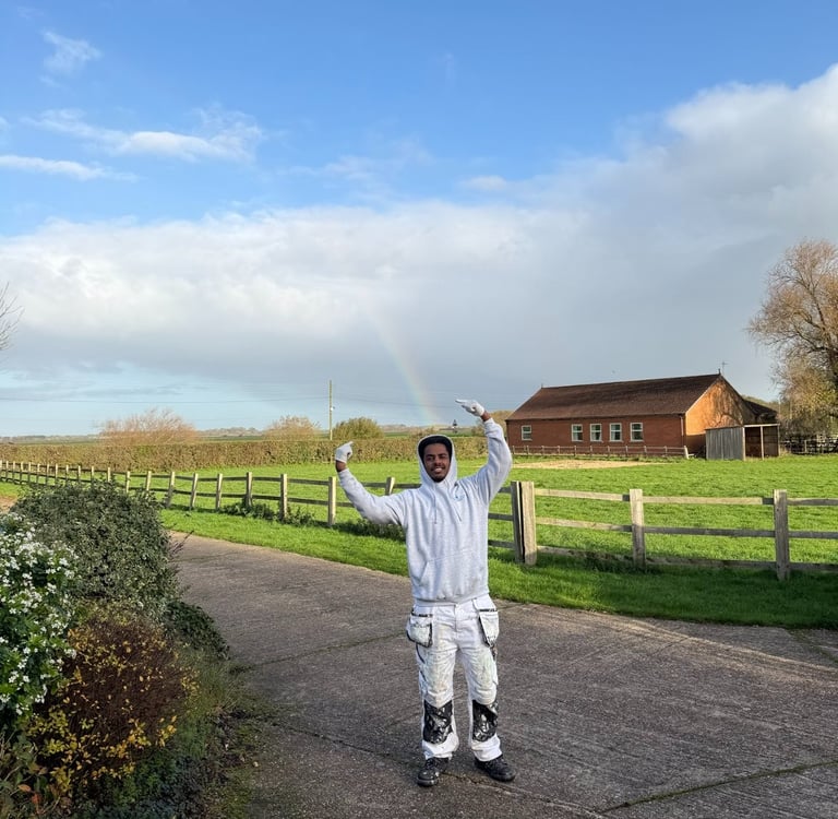 A staff member posing outside a property.