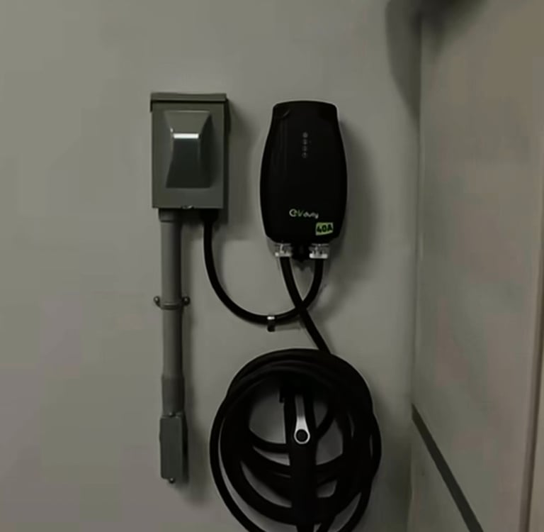 Installation d'une borne de recharge électrique résidentielle par un électricien.