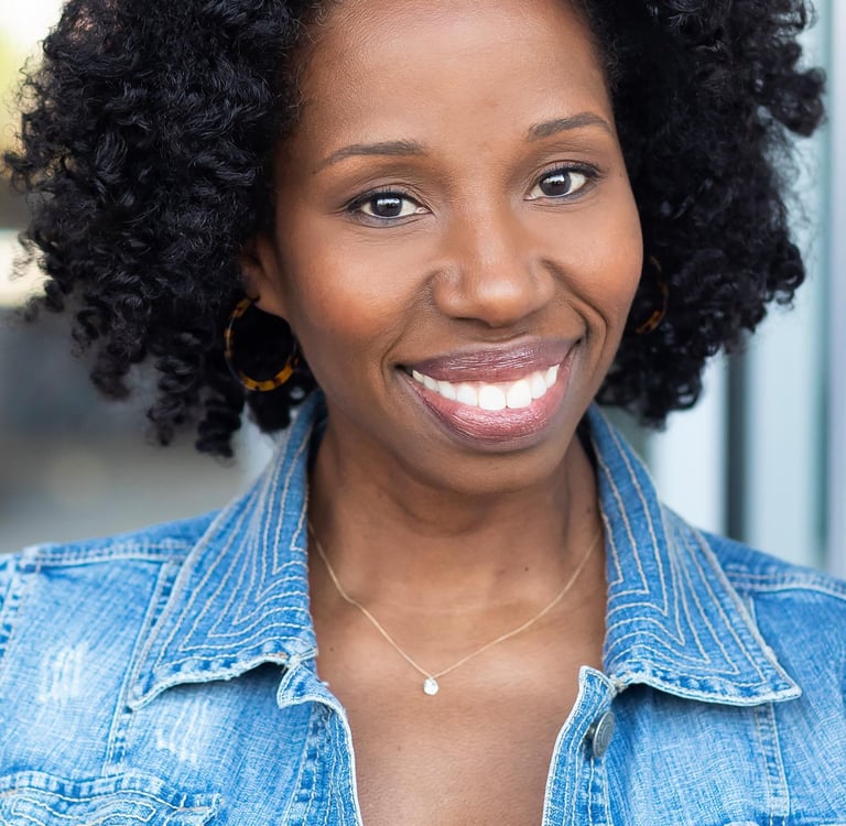 Headshot of Tracie Frank with a bright, friendly smile.