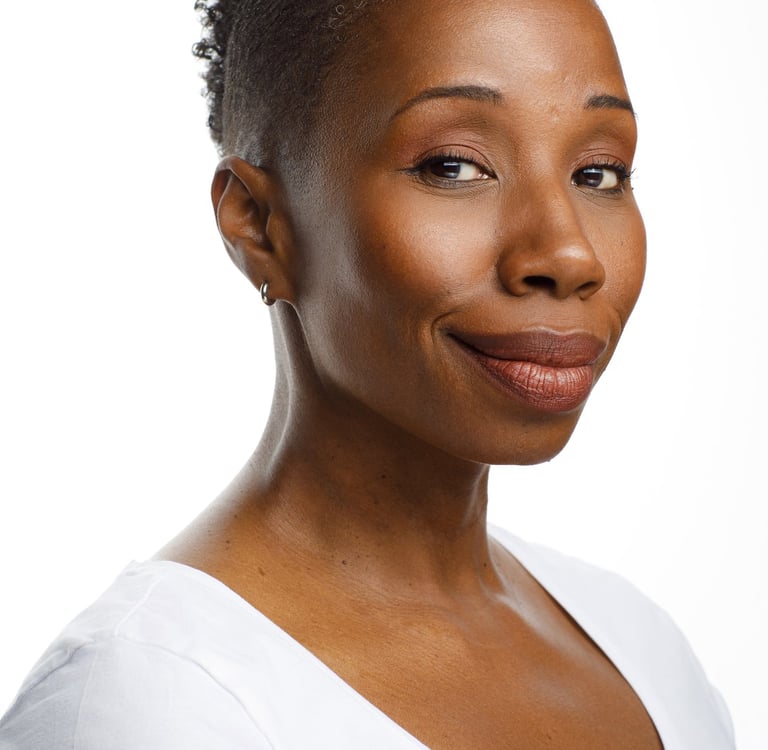 Photo of Tracie Frank with a knowing smile.