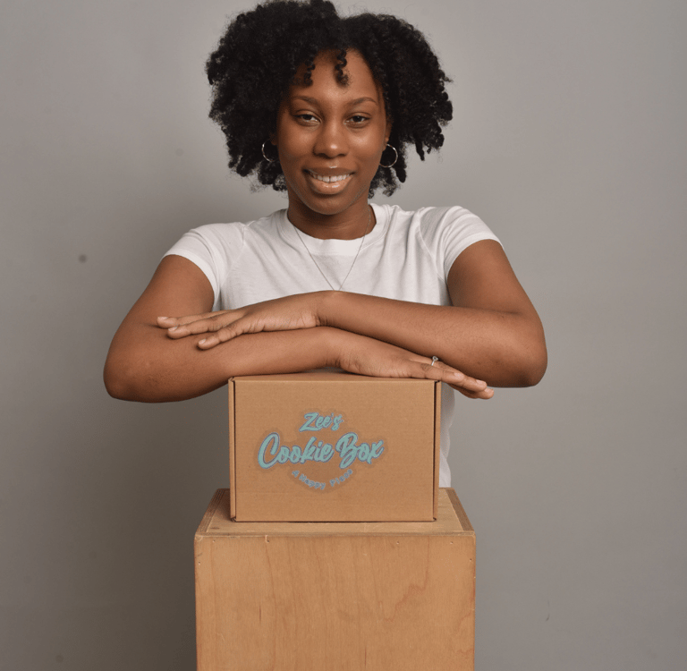 beautiful black woman smiling with cookies