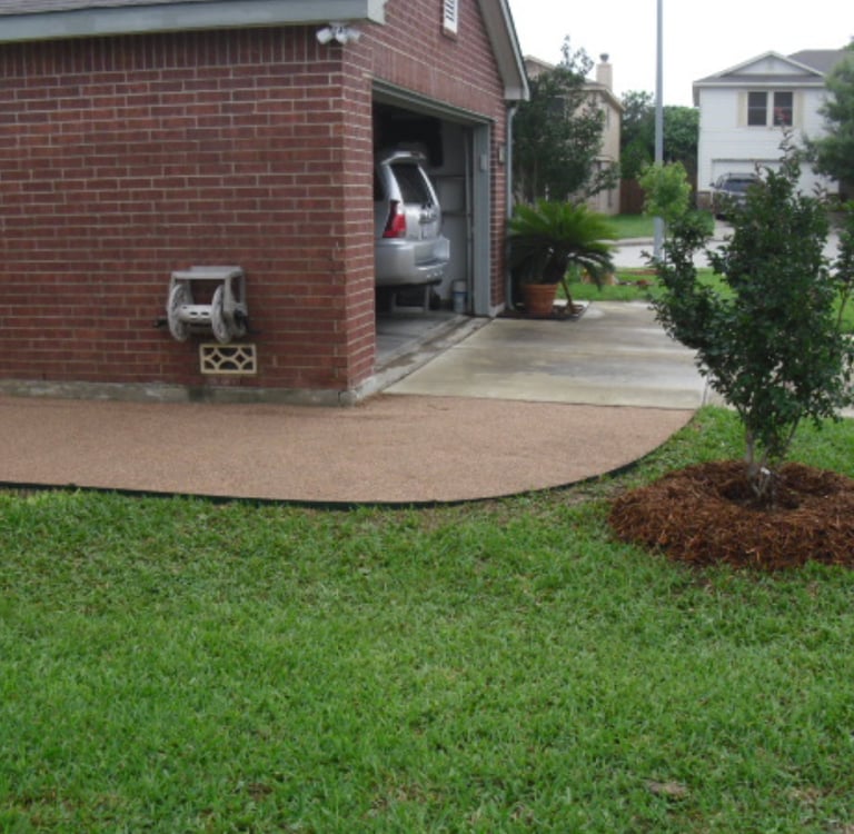 decomposed granite walkway alongside house 