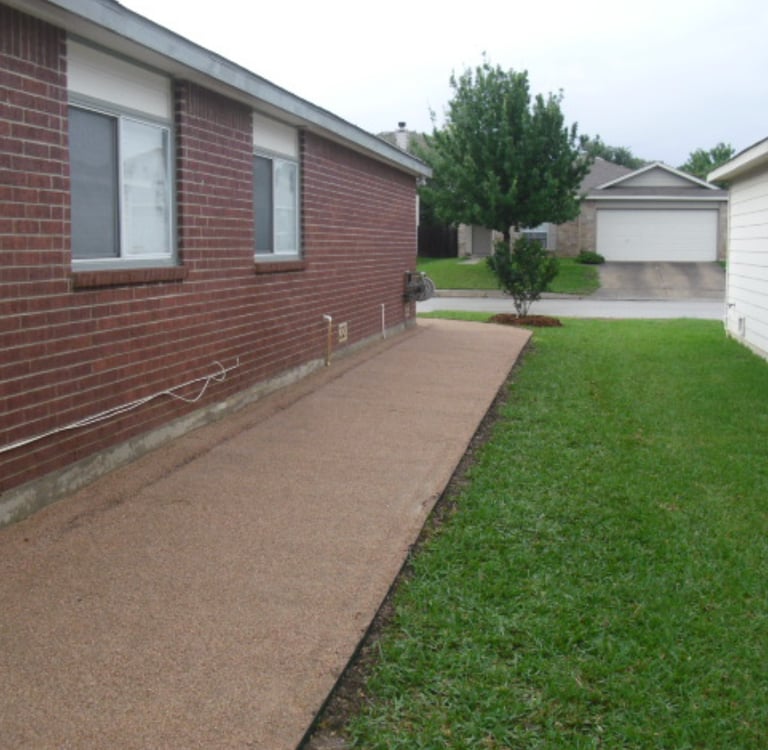 decomposed granite walkway on side of house 