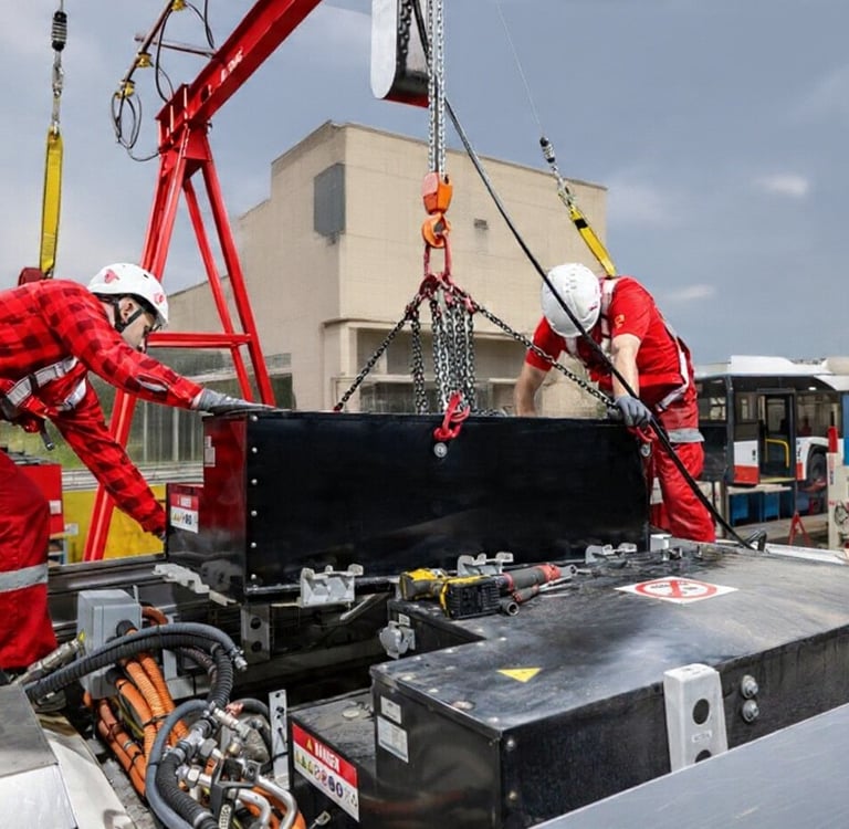 Technicians installing the EV batteries