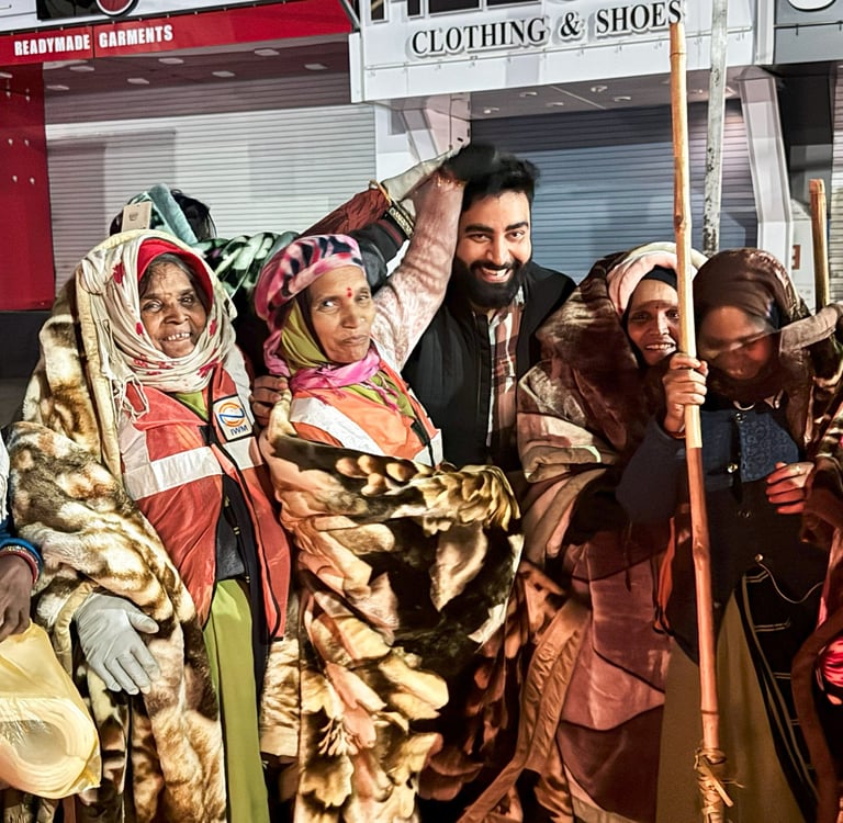 Community blanket drive with volunteers distributing warm blankets to people in need on a street