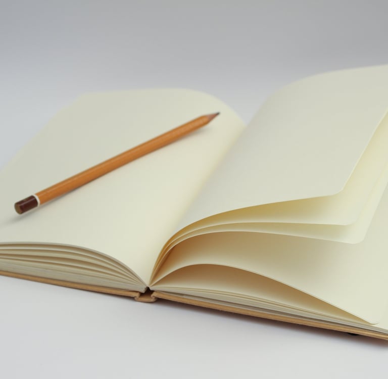 a pencil and pencil on a notebook with a pencil and pencil