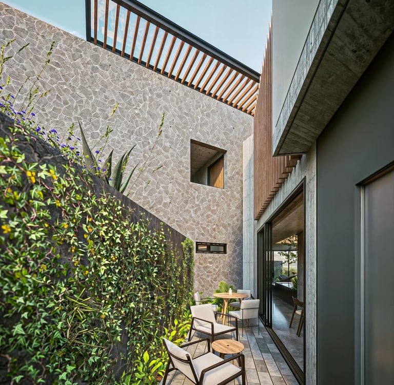 terraza de casa con materiales de piedra, concreto y piedra