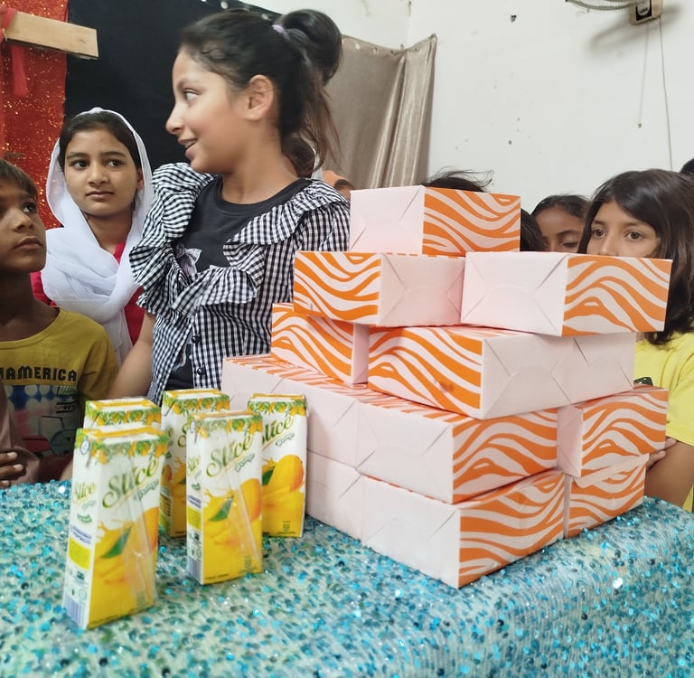 Abigail Amir Fazal distributing food and drinks to Sunday School children