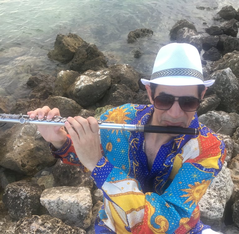 Bobby Ramirez playing flutewearing his iconis shirt fom his first CD cover
