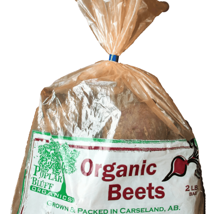Clear plastic bag of beets with Poplar Bluff Organics logo