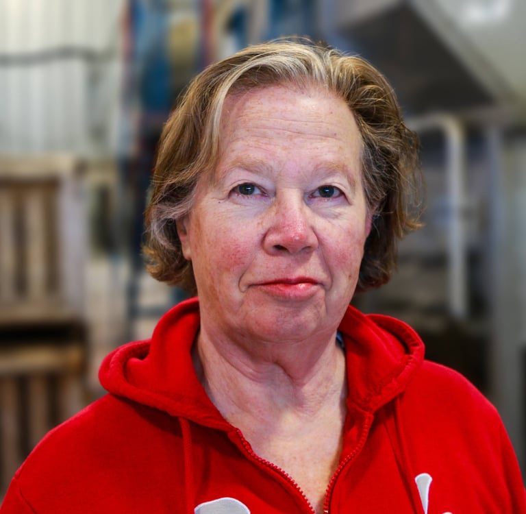 Rosemary Wotske Founder of Poplar Bluff Organics wearing red sweater