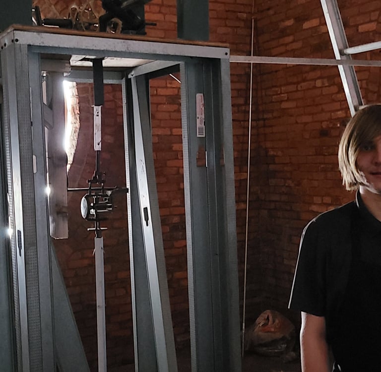 The owner of the lutz clock company inside a tower clock