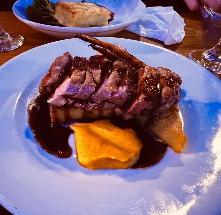 a plate of food and a glass of wine