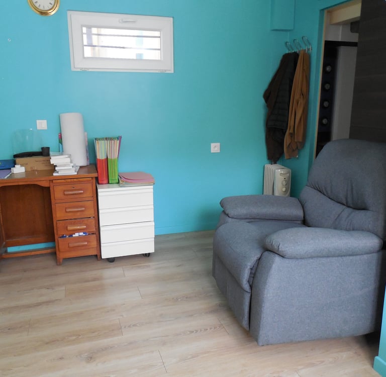 a chair with a chair and a desk with a mirror