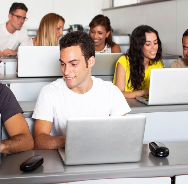 a group of people sitting at desks in a classroom-Ai-Integrated Digital Academy