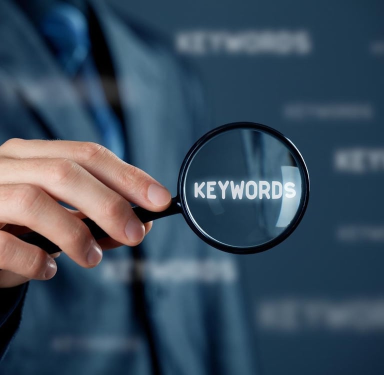 a person holding a magnifying magnifying magnifying a keyword - Illford Academy