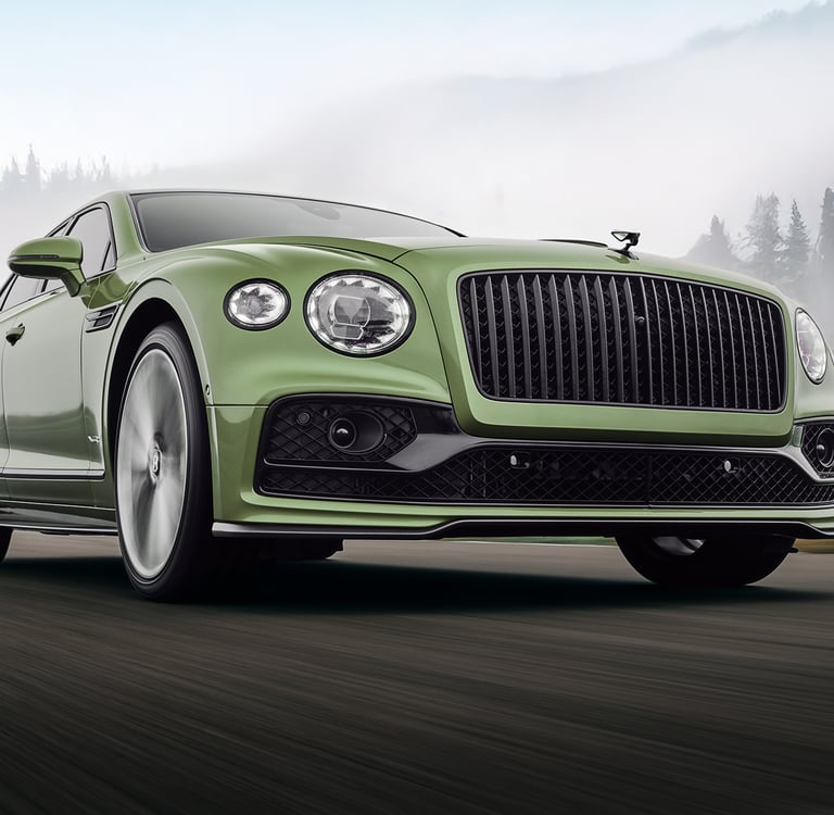 a green bentley rolling shot