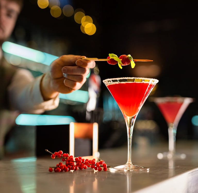 man making cocktail in a bar