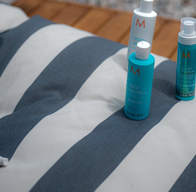 a group of three different types of hair products